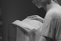 Economica Book List: Image of a female statue reading a book