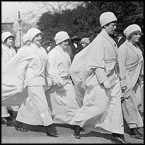 suffrage activists parade for voting rights in the U.S in 1930s 
